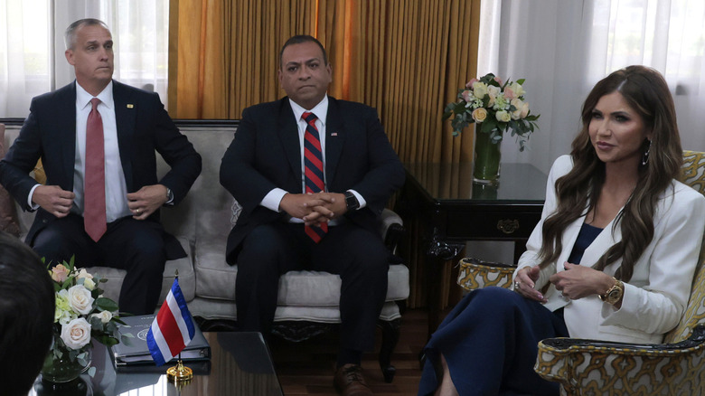 Kristi Noem and Corey Lewandowski sit in a meeting on official business in Costa Rica.