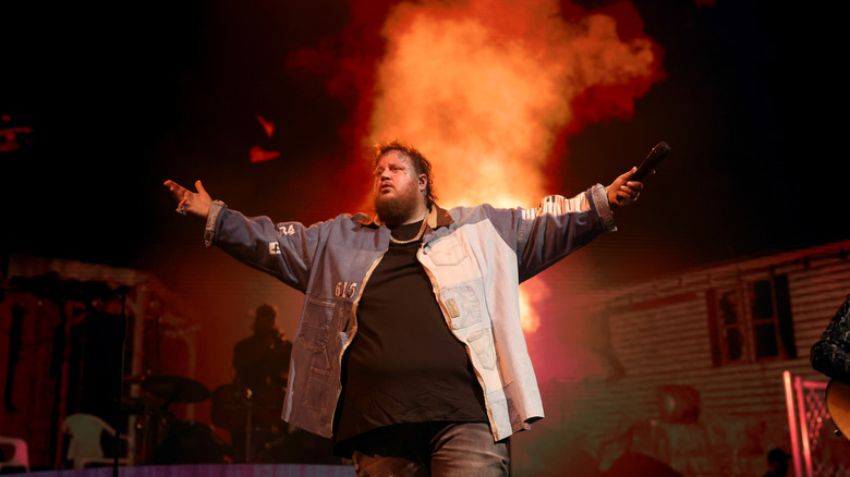 Jelly Roll in concert with plume of smoke