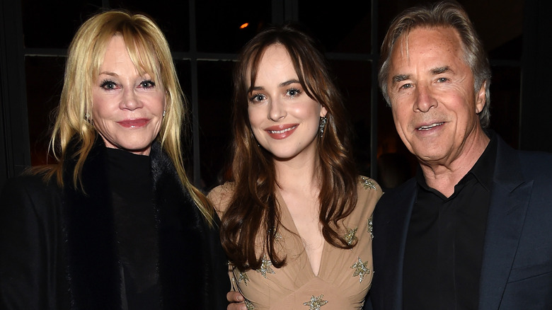 Dakota Johnson posing with mom, dad