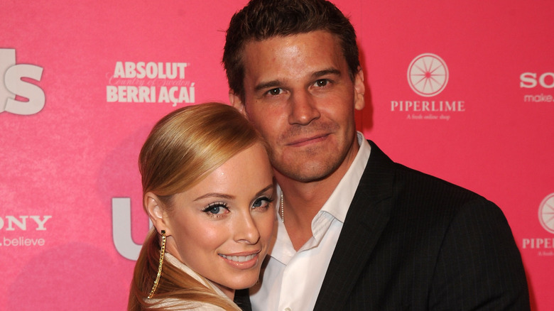 David Boreanaz and Jaime Bergman posing together and smiling