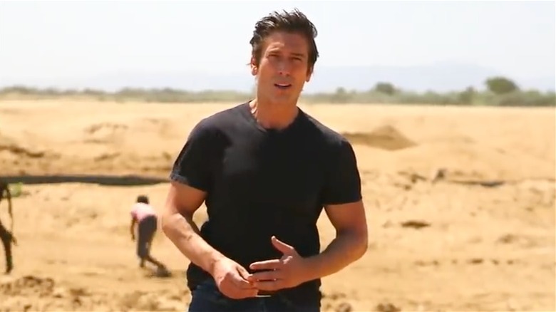 David Muir standing in a field in Madagascar
