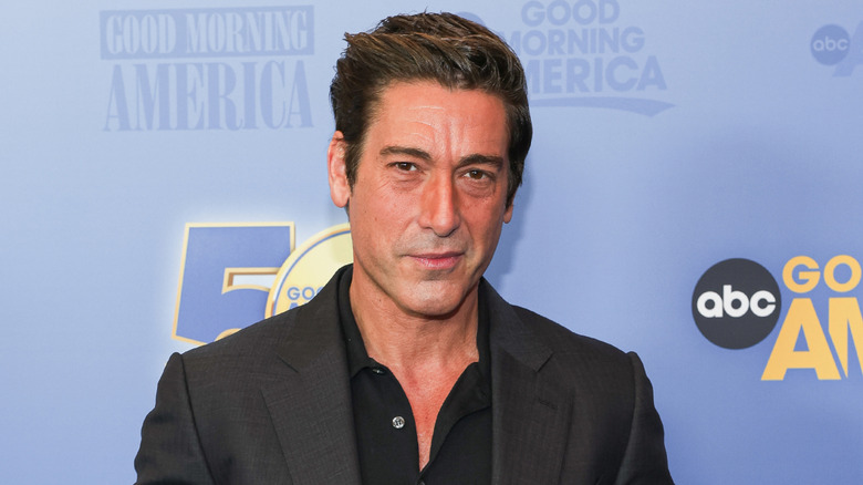 David Muir posing and smiling