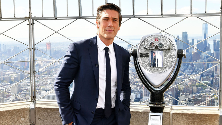 David Muir posing at the top of the Empire State Building to celebrate the 40th season of ABC's 20/20