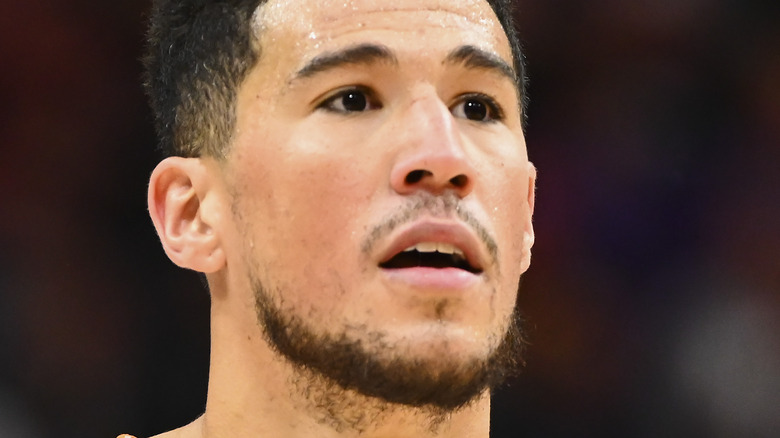 Devin Booker, posing with mouth open