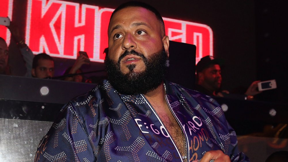 DJ Khaled in a purple bomber