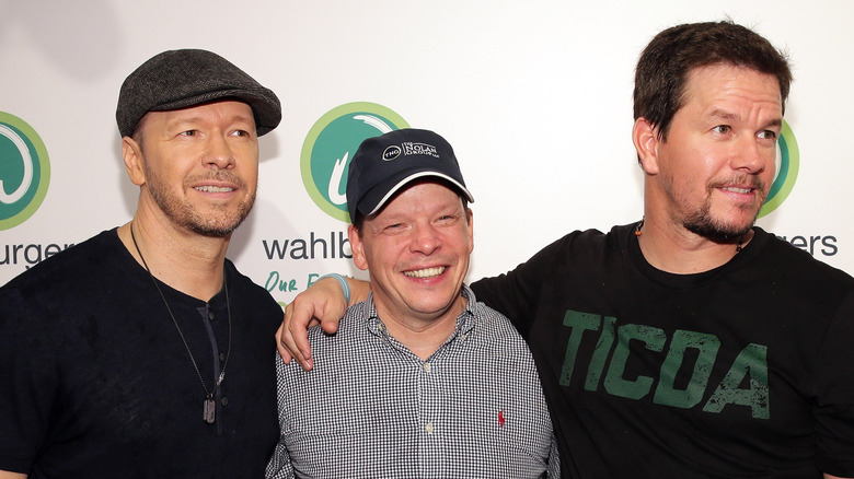 Donnie, Paul, and Mark Wahlberg posing