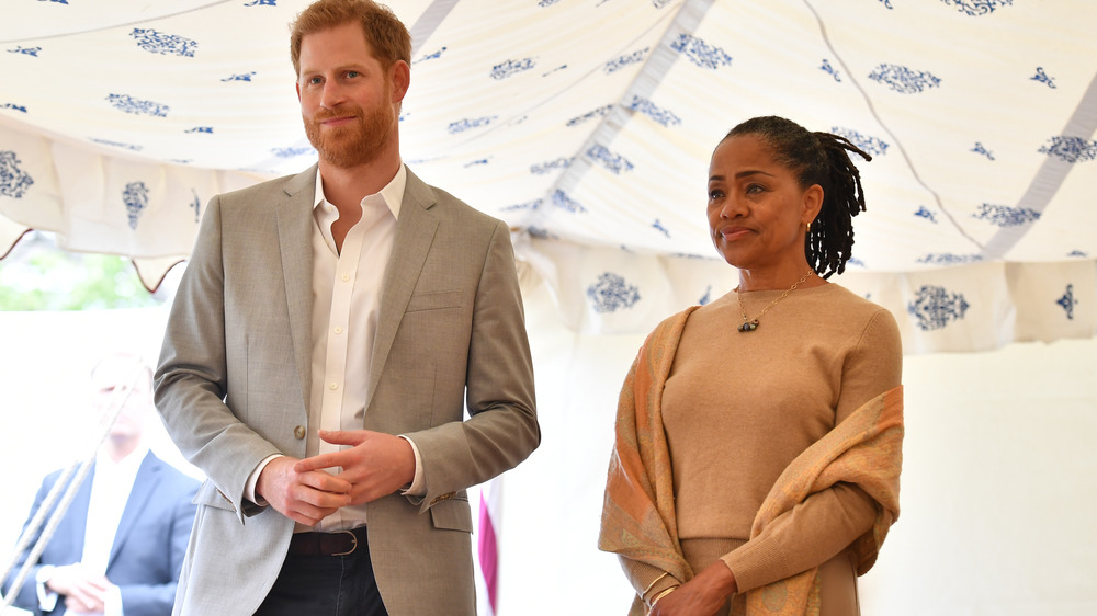 Prince Harry standing with Doria Ragland