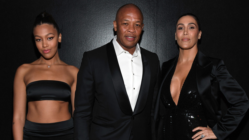 Truly Young, Dr. Dre, and Nicole Young pose on the red carpet