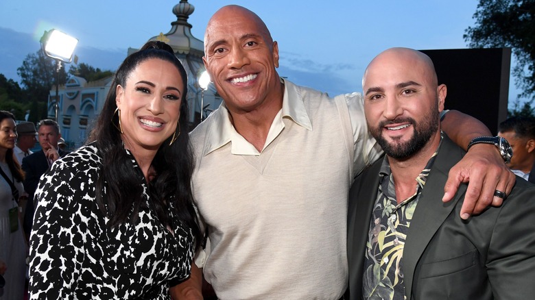 Dany Garcia, Dwayne Johnson, and Dave Rienzi smiling