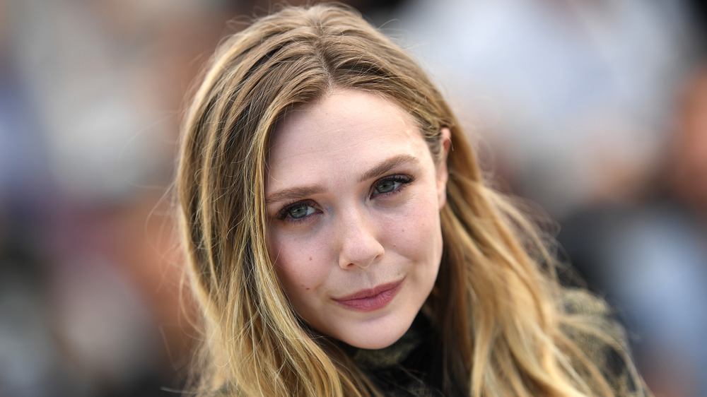 Elizabeth Olsen smirking