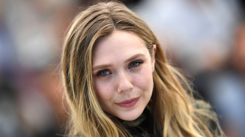 Elizabeth Olsen smirking