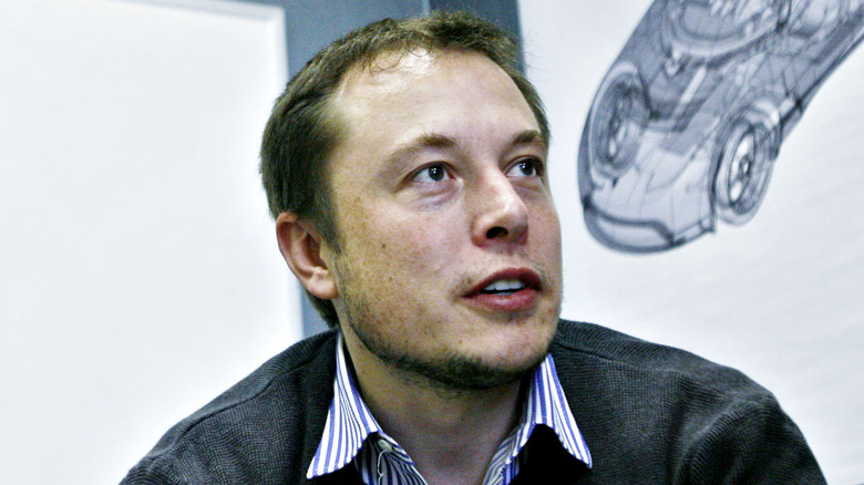 Elon Musk at a desk