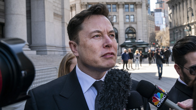 Elon Musk speaking to reporters