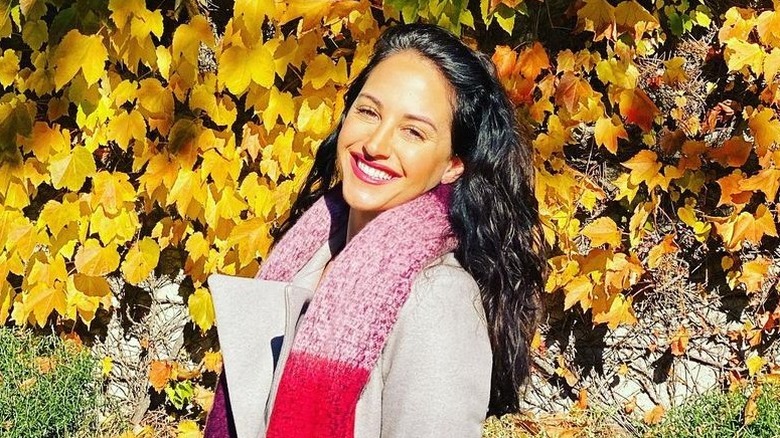 Emily Compagno posing with fall leaves