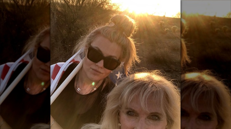 Lori Frantzve and Erika Kirk selfie outside