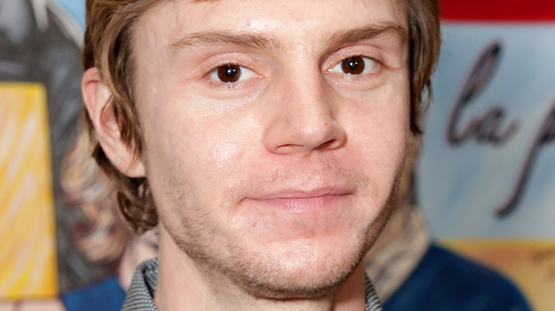 Evan Peters very slightly smiling