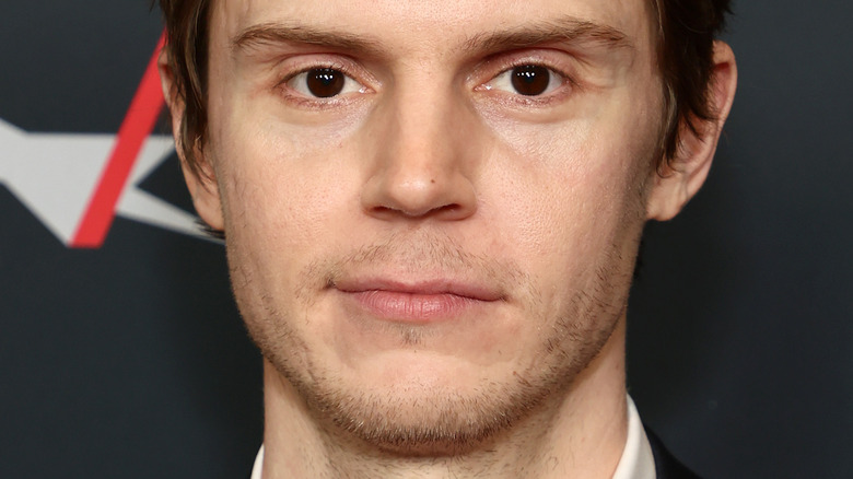 Evan Peters with an unbuttoned shirt