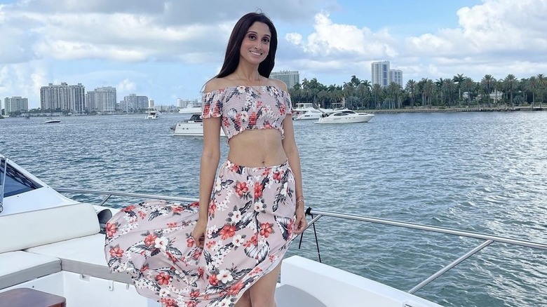 Anisha Ramakrishna, smiling, on a boat