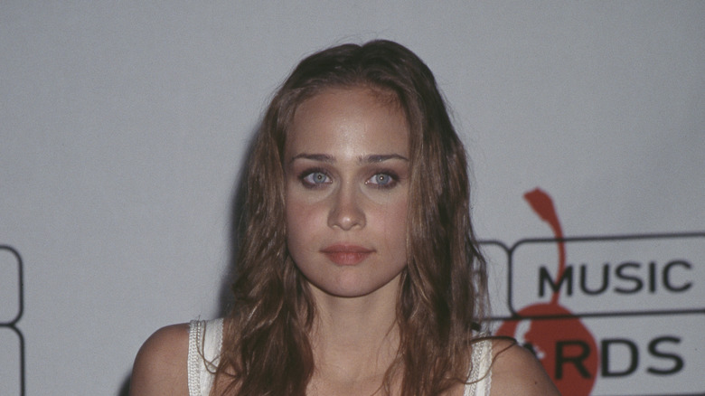 Fiona Apple posing white dress