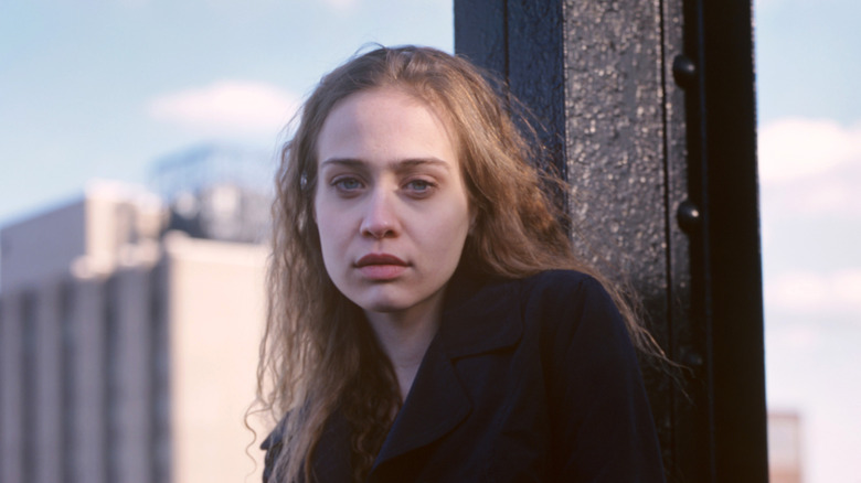 teenage Fiona Apple posing outside