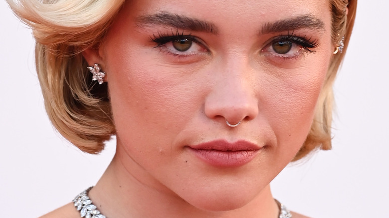 Florence Pugh with short hair, posing