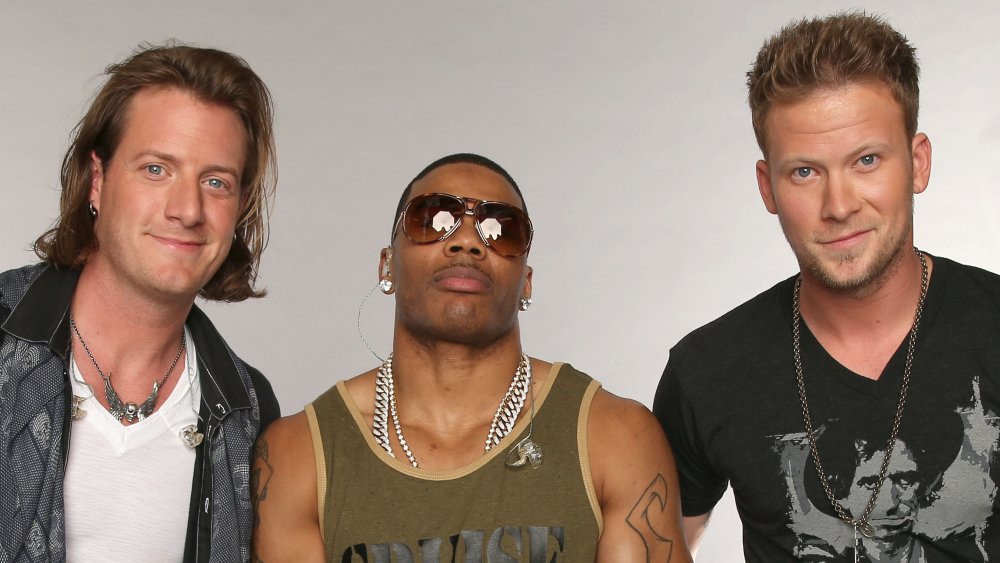Brian Kelley, Nelly and Tyler Hubbard all posing together