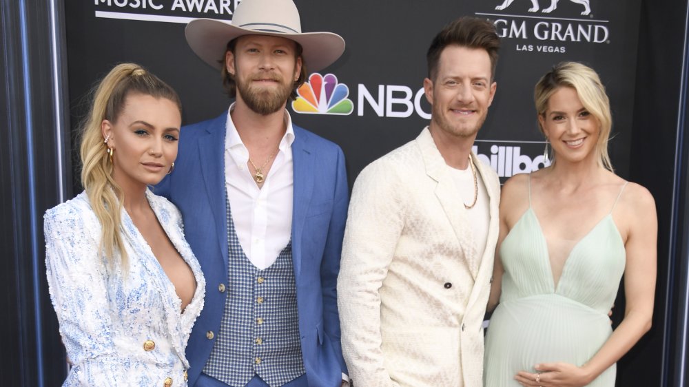 Brittney Marie Cole Kelley, Brian Kelley, Tyler Hubbard, and Hayley Stommel Hubbard posing together