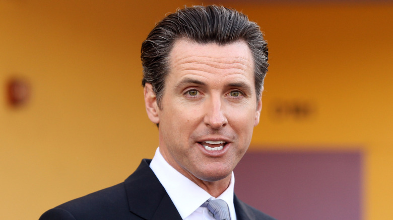 Gavin Newsom speaking at a campaign rally 