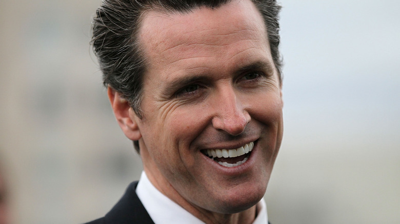 Gavin Newsom smiling at an event