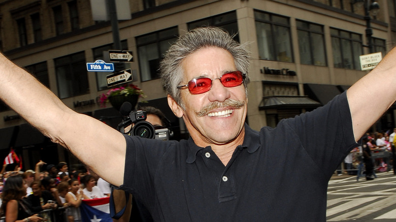 Geraldo Rivera raising arms
