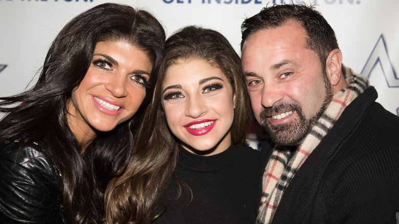 Gia Giudice and her parents, all smiling