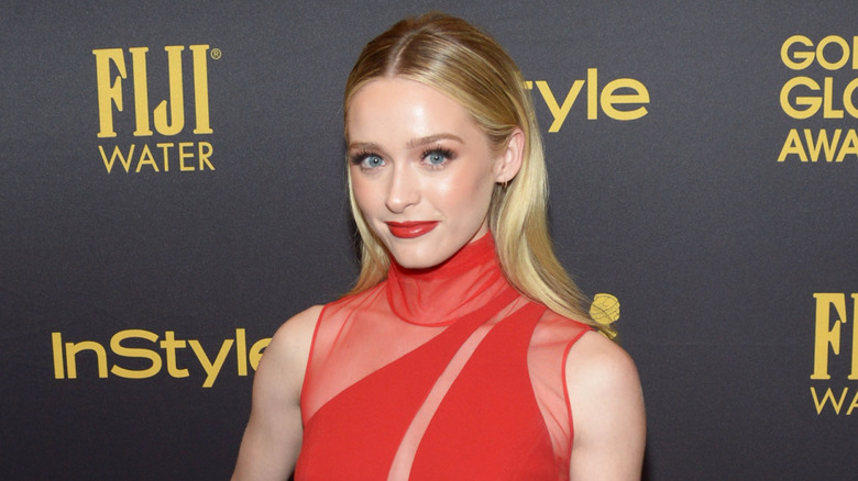 Greer Grammer wearing red at an event