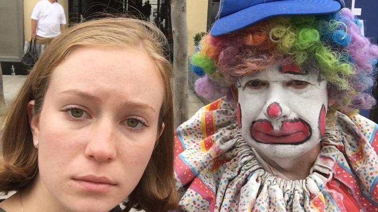 Hannah Einbinder posing with a clown