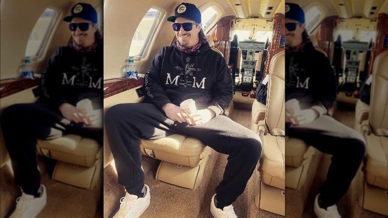HARDY smiling on a private plane