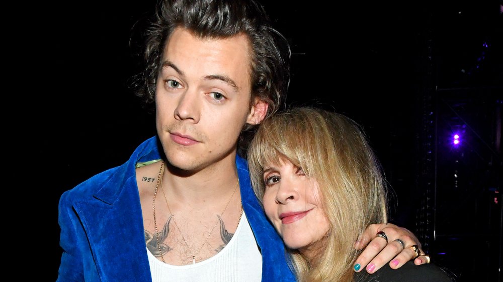 Harry Styles and Stevie Nicks posing arm in arm