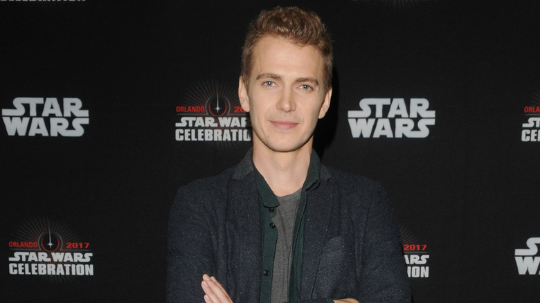 Hayden Christensen, arms crossed and posing