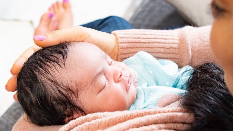 Egypt Sherrod cradling her newborn daughter Harper in 2019