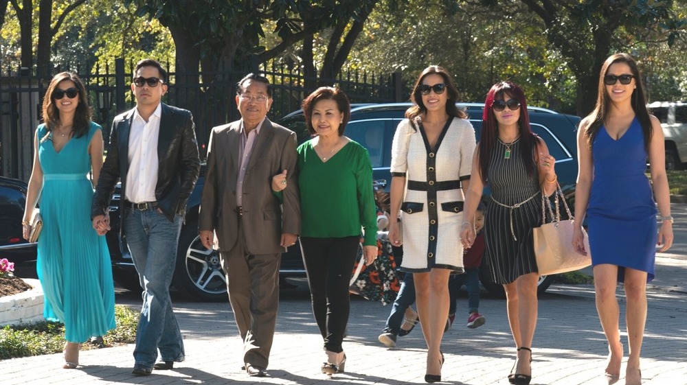 Members of the Ho family walking down the street