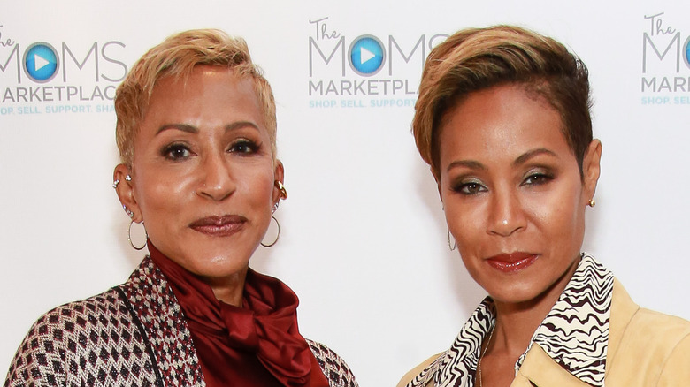 Adrienne Banfield-Norris and Jada Pinkett Smith posing together on the red carpet