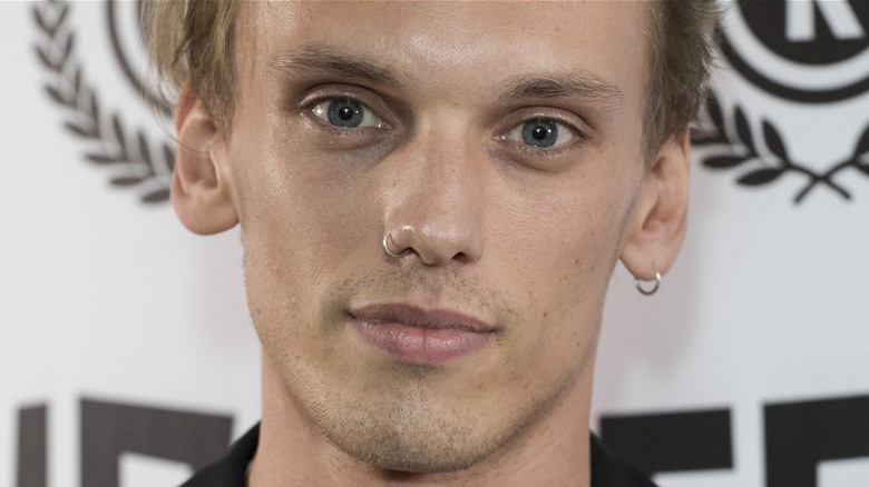 Jamie Campbell Bower smiling