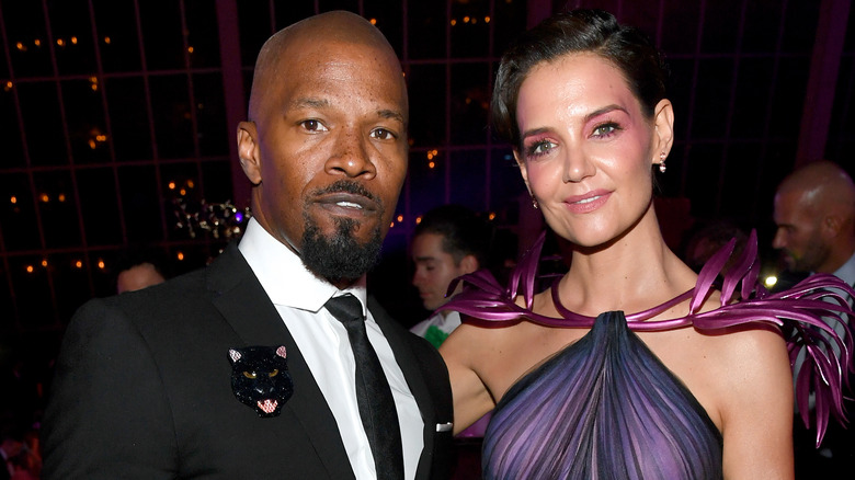 Jamie Foxx posing with Katie Holmes