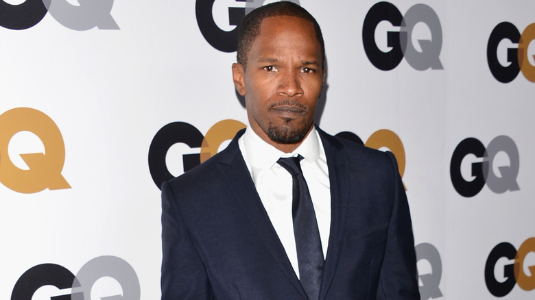 Jamie Foxx posing at GQ event