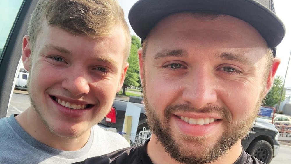 Justin Duggar and Jason Duggar smile