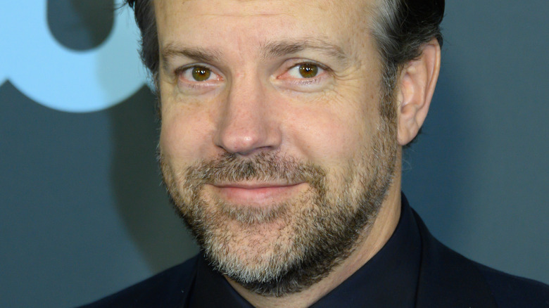 Jason Sudeikis smiling at an event
