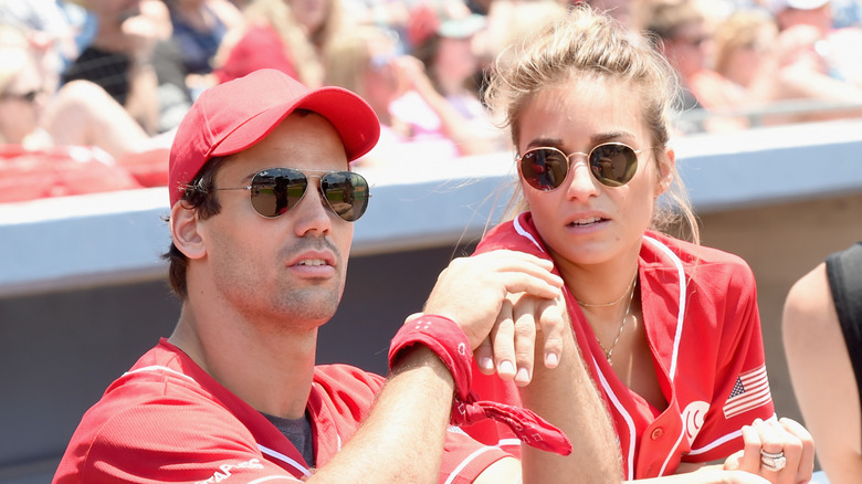 Eric Decker and Jessie James Decker at a baseball game