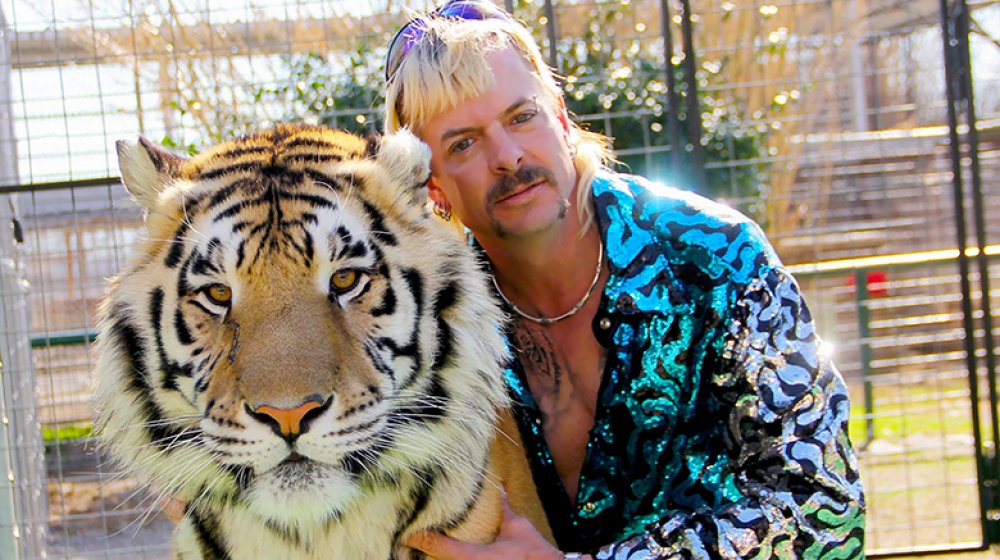 Joe Exotic posing with tiger