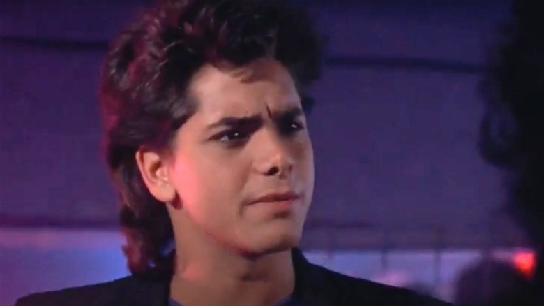 John Stamos in Never Too Young to Die