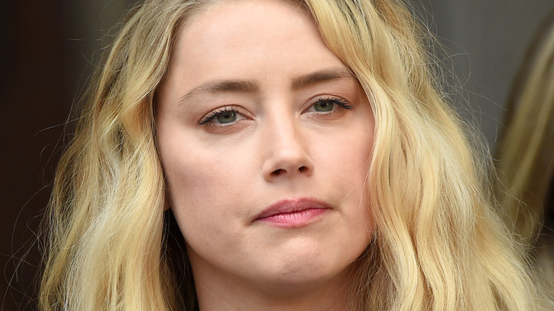 Amber Heard frowns