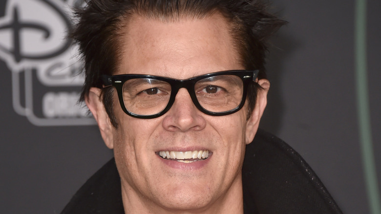 Johnny Knoxville in a black coat