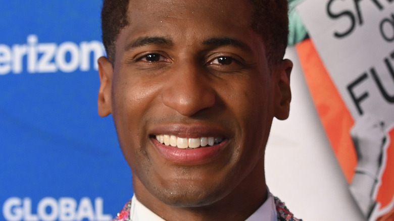 Jon Batiste smiling at an event